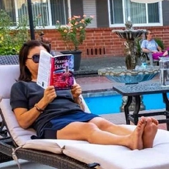 Woman relaxing with book